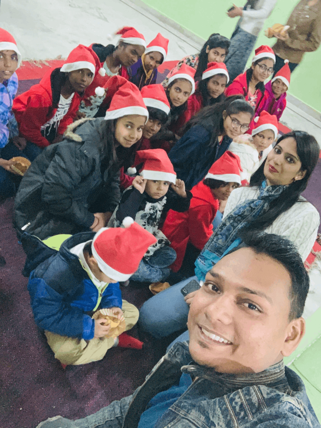 Children wearing Santa hats during the Christmas celebration